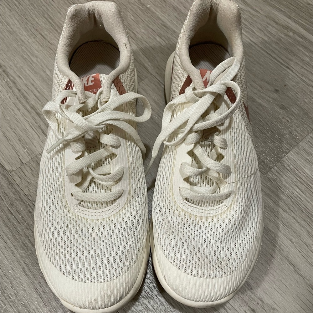 Nike rose gold and ivory tennis shoes size 7